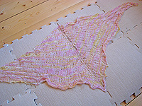 gently place the shawl on your blocking surface